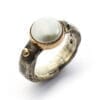 Ring of silver with one brilliant cut diamond and big pearl in gold collet
